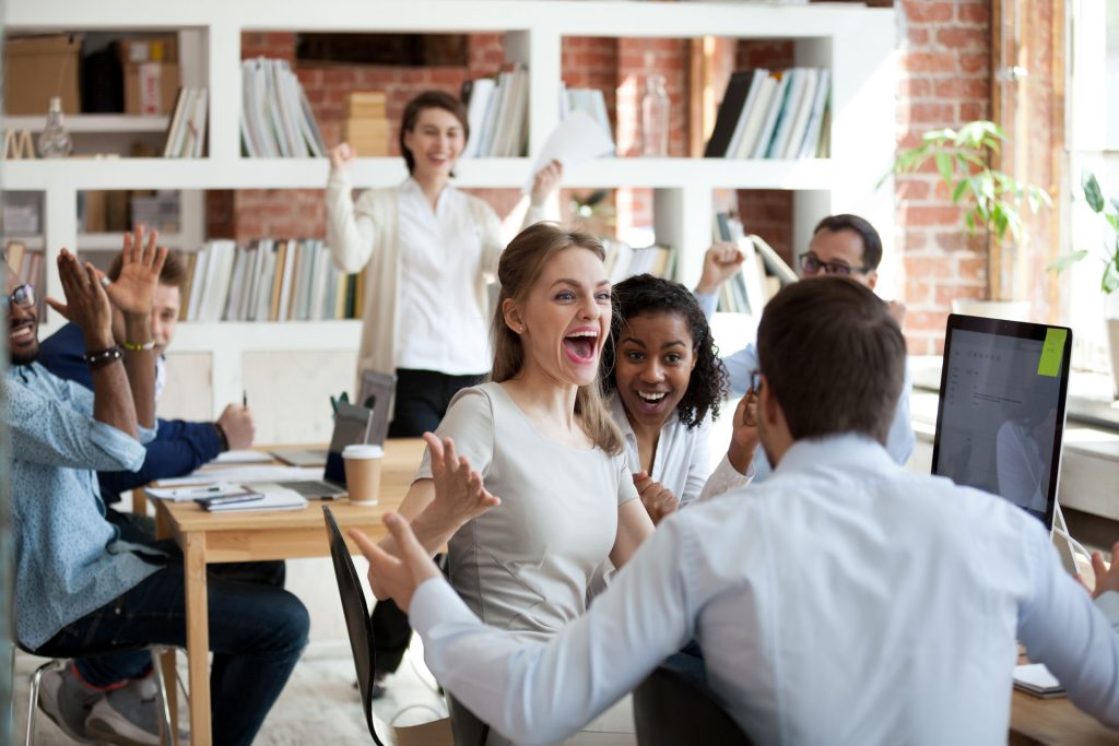 Excited,diverse,business,team,employees,screaming,celebrating,good,news,business